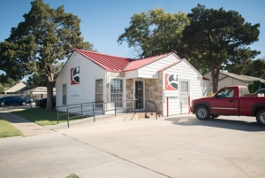 A photo of the Lubbock Integrated Medical Institute office exterior and parking lot